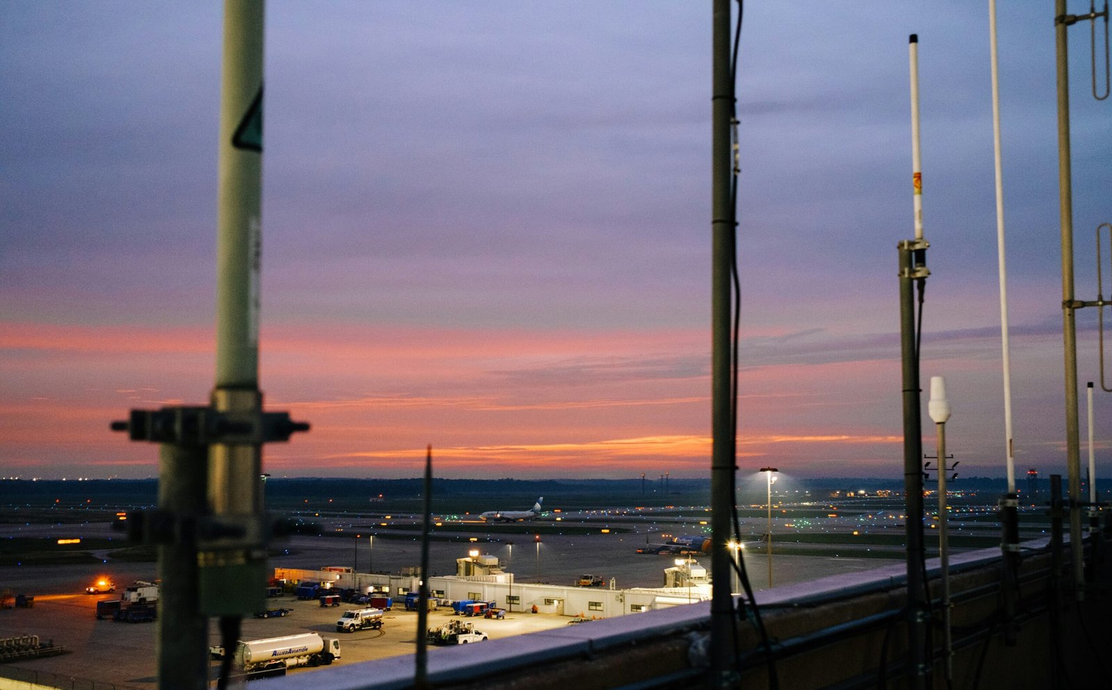 A view of a city at dusk from a balcony